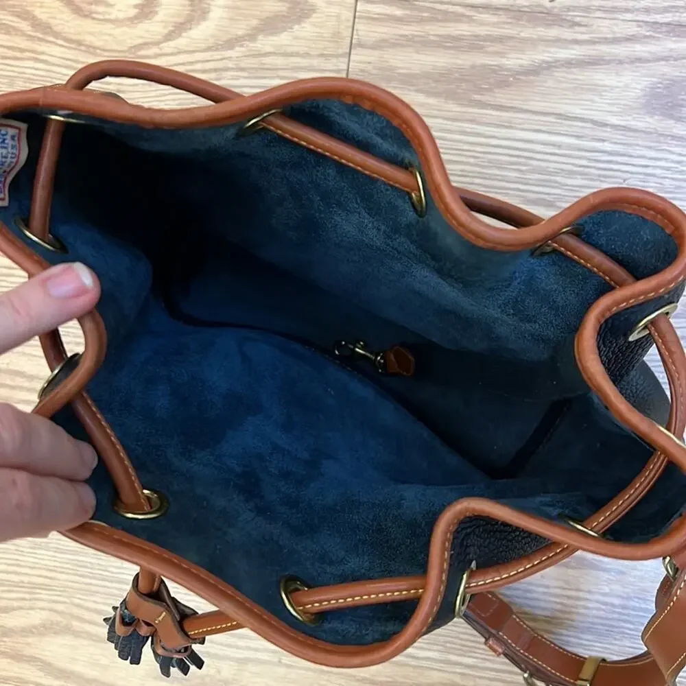 Dooney & Bourke tassel bucket bag blue pebbled leather tan accent gold hardware